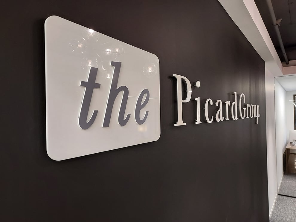 Acrylic Signs in Charlotte, NC designed and installed for business office walls and branded interiors