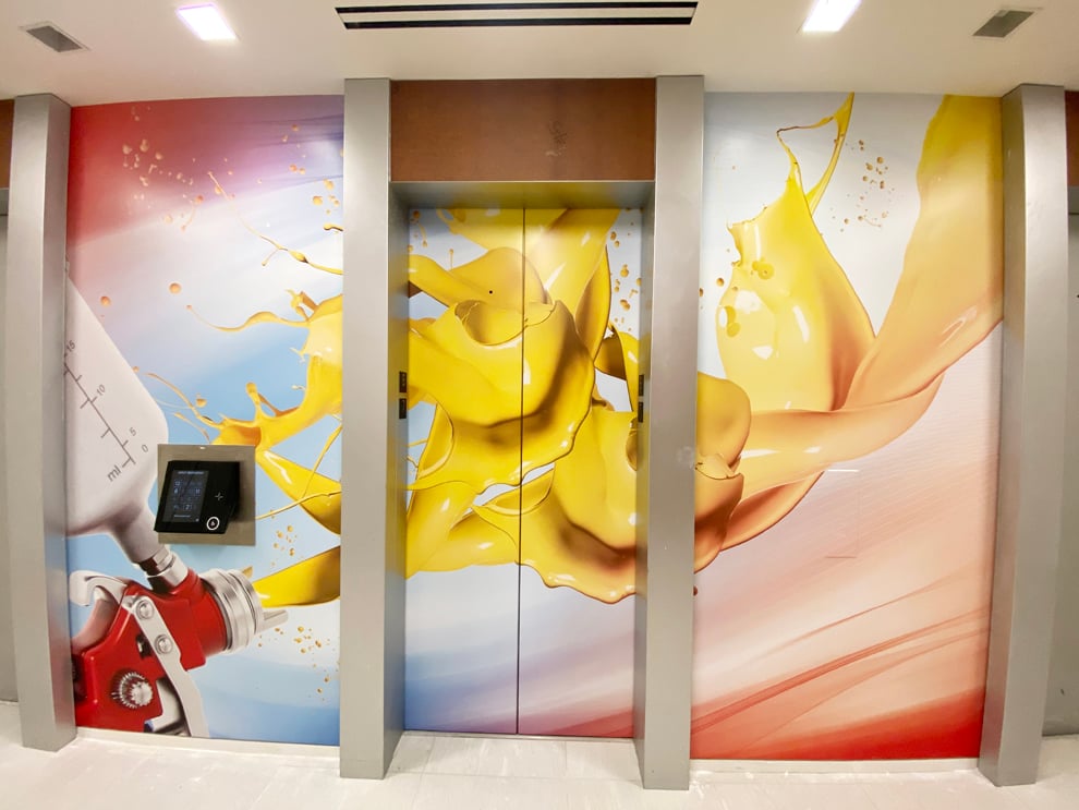 Elevator Wraps in Charlotte, NC designed and installed for corporate offices and interior signage