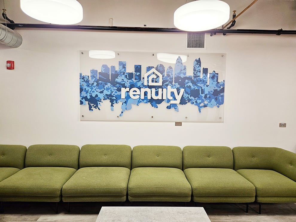 Lobby Signs Charlotte NC designed and installed with acrylic standoff panels for branded workplace interiors